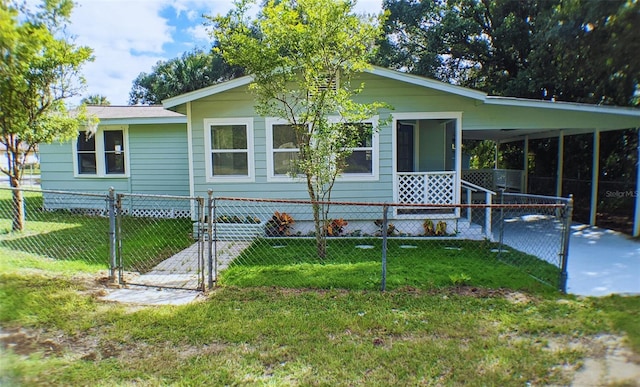 view of front facade with a front yard and a carport