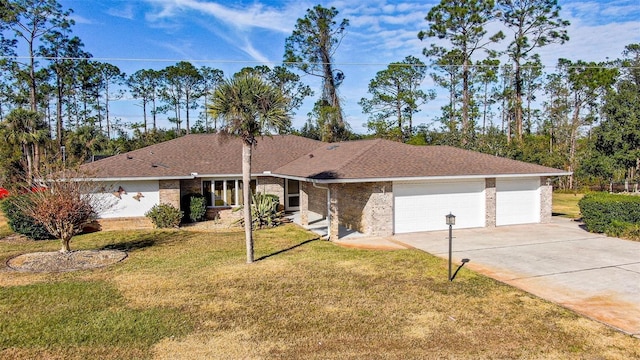 ranch-style home featuring a front lawn and a garage