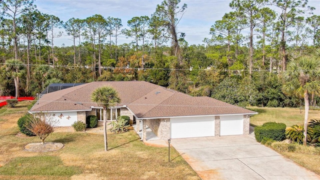 view of front facade with a garage and a front yard