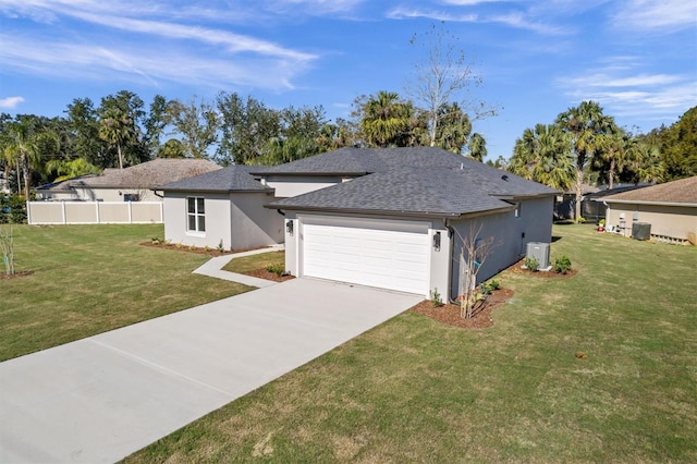 view of front of property featuring a garage and a front lawn