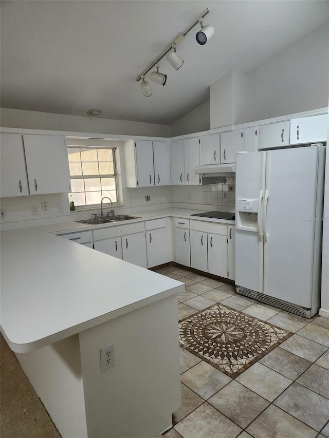 kitchen featuring black electric cooktop, white refrigerator with ice dispenser, a sink, white cabinets, and light countertops