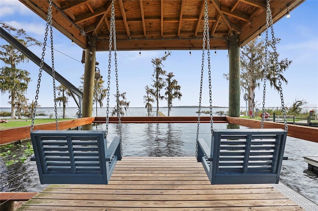 view of dock featuring a water view and a gazebo