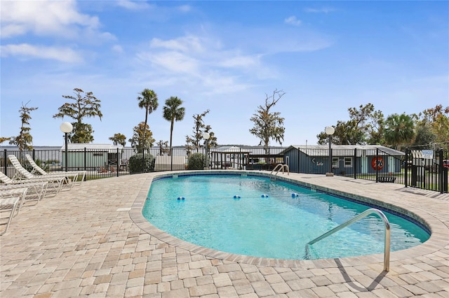 view of swimming pool featuring a patio