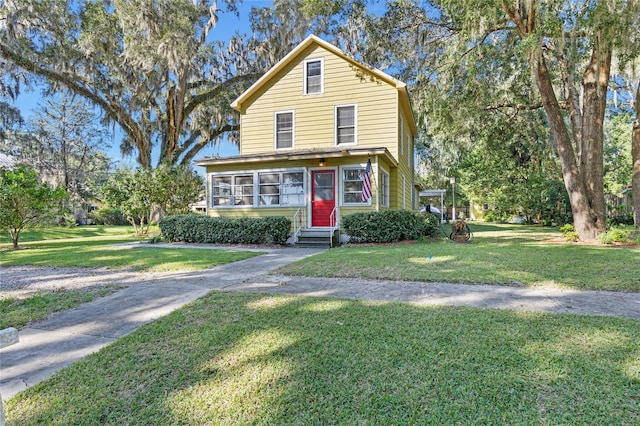 front facade featuring a front lawn