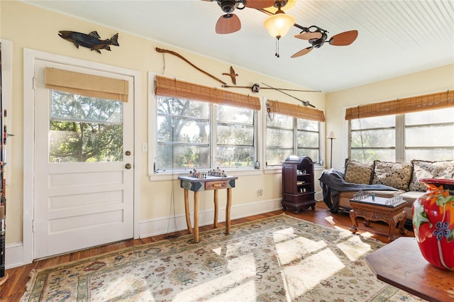 sunroom featuring ceiling fan