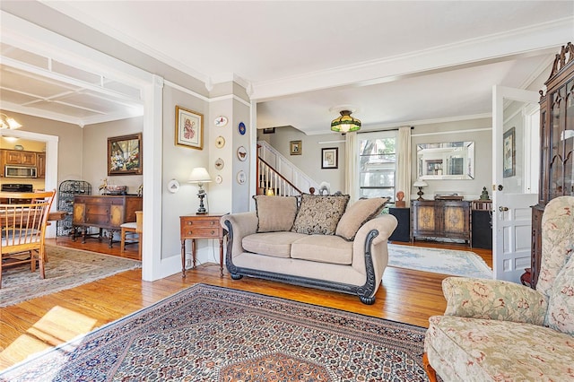 living room with crown molding and wood-type flooring