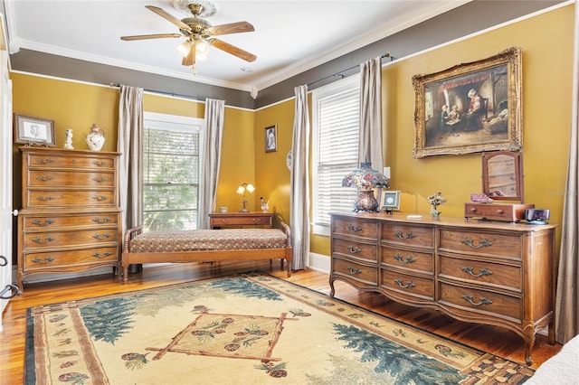 sitting room featuring light wood-type flooring, a healthy amount of sunlight, and ceiling fan