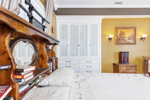 bedroom with ornamental molding