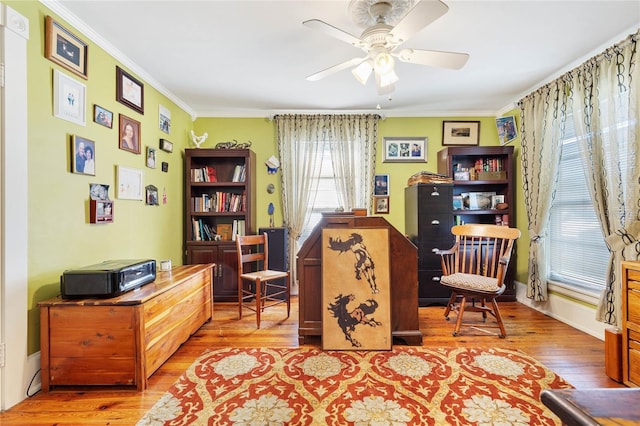 home office with ceiling fan, wood-type flooring, and ornamental molding