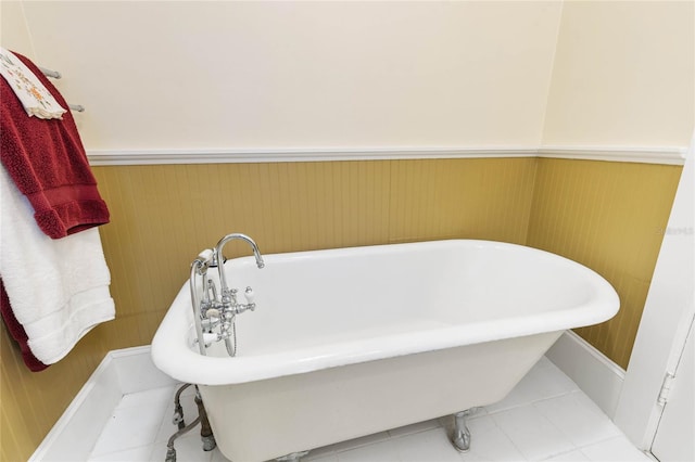 bathroom featuring a bath and tile patterned flooring