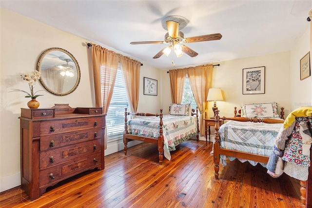 bedroom featuring ceiling fan and wood-type flooring