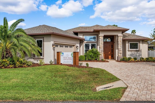 prairie-style house with a front yard and a garage