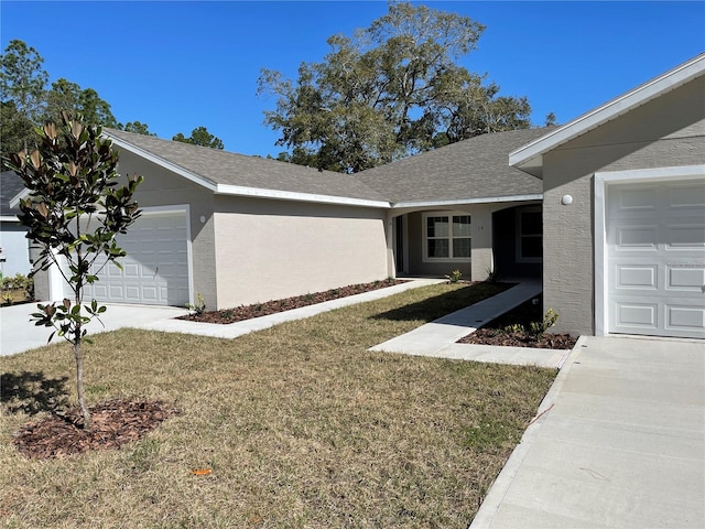 view of side of home with a garage and a lawn