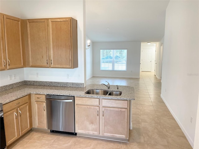 kitchen with sink, stainless steel dishwasher, light tile patterned floors, and light stone countertops