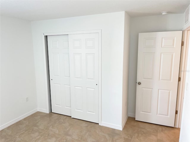 unfurnished bedroom featuring a closet