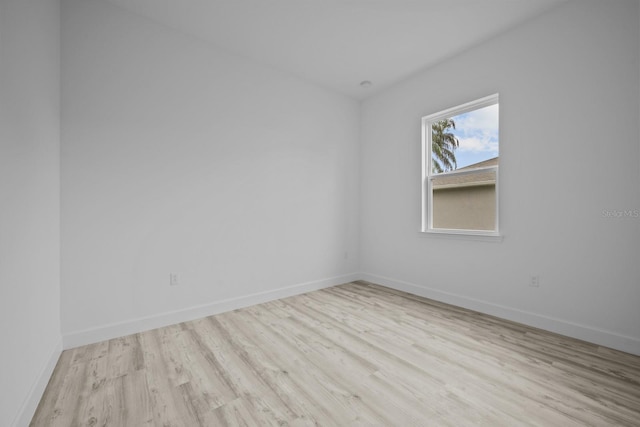 spare room with light hardwood / wood-style flooring