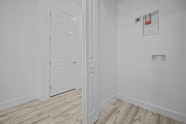 laundry room with light hardwood / wood-style floors, electric dryer hookup, and washer hookup