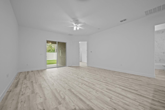 spare room with light hardwood / wood-style floors and ceiling fan