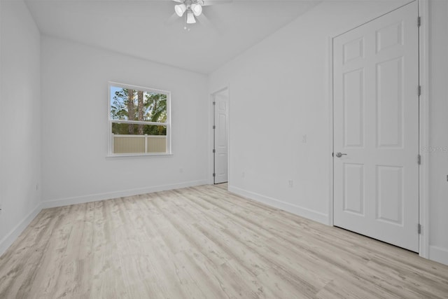 spare room featuring light wood-type flooring and ceiling fan