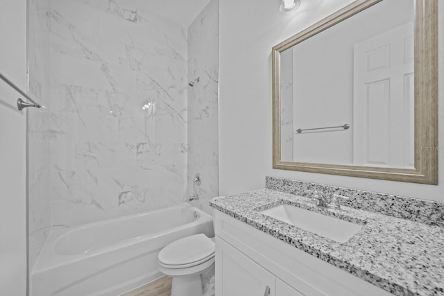 full bathroom featuring toilet, tiled shower / bath combo, vanity, and hardwood / wood-style flooring