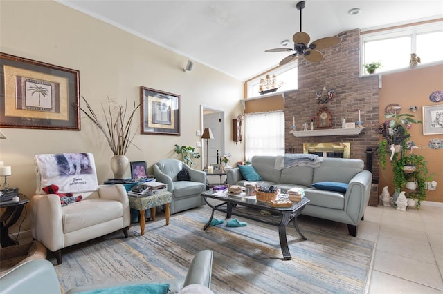 living room with tile patterned floors, ceiling fan, a fireplace, and high vaulted ceiling