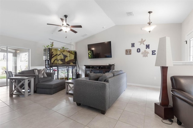 living room with lofted ceiling, light tile patterned floors, and ceiling fan