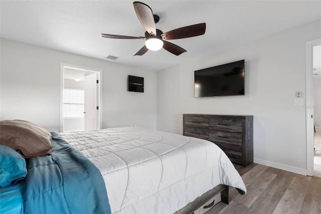 bedroom with light hardwood / wood-style flooring and ceiling fan