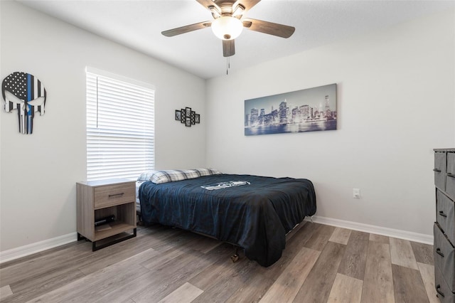 bedroom featuring light wood-type flooring and ceiling fan