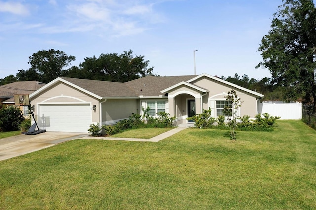 ranch-style home with a garage and a front yard