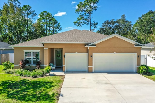 ranch-style home featuring a garage and a front lawn