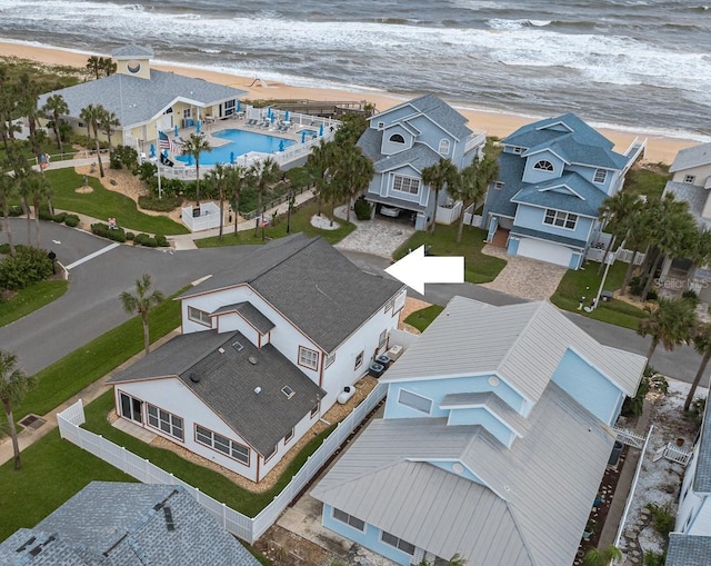 aerial view with a water view and a view of the beach