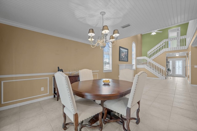 tiled dining area featuring wood ceiling, ornamental molding, a wealth of natural light, and ceiling fan with notable chandelier