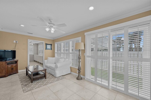 53 Sea Vista Dr, Palm Coast, FL 32137 - living room featuring plenty of natural light, a ceiling fan, light tile patterned floors, ornamental molding, and recessed lighting