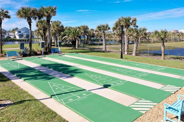53 Sea Vista Dr, Palm Coast, FL 32137 - view of home's community featuring a lawn, a water view, and shuffleboard