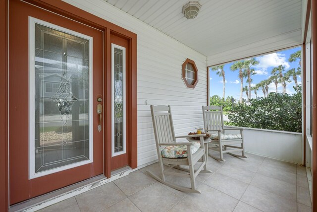 53 Sea Vista Dr, Palm Coast, FL 32137 - sunroom with tile patterned flooring