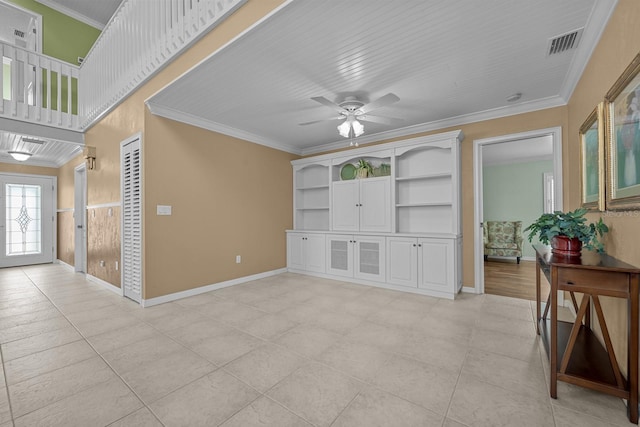 tiled living room with crown molding, built in features, and ceiling fan