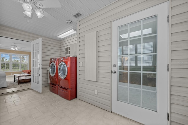 53 Sea Vista Dr, Palm Coast, FL 32137 - clothes washing area with independent washer and dryer, a ceiling fan, french doors, and wooden walls
