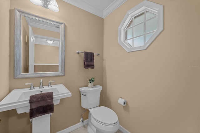 bathroom featuring toilet and crown molding