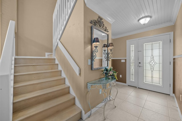 tiled entrance foyer with wood ceiling and ornamental molding