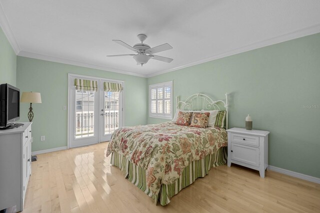 53 Sea Vista Dr, Palm Coast, FL 32137 - bedroom with access to outside, french doors, light wood-style floors, crown molding, and baseboards