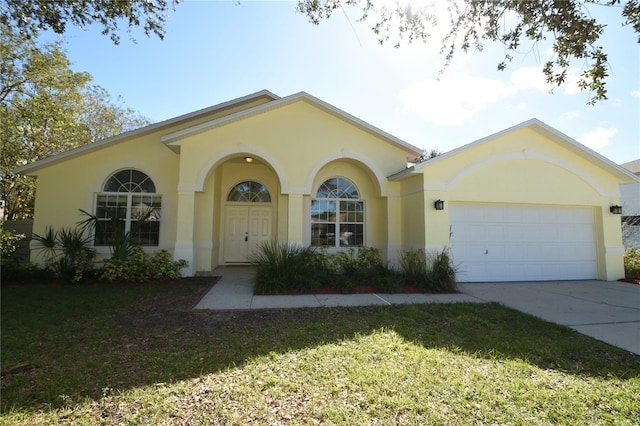 view of front of home featuring a front yard and a garage