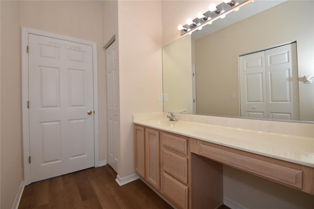 bathroom featuring vanity and wood-type flooring