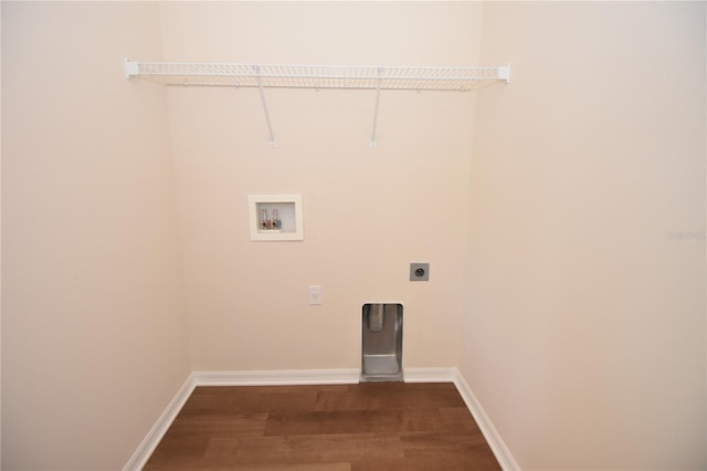 laundry area featuring dark hardwood / wood-style floors, washer hookup, and hookup for an electric dryer