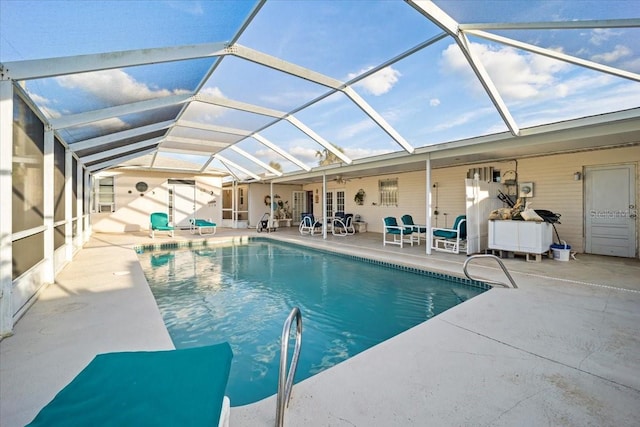 view of pool featuring a patio, a lanai, and ceiling fan