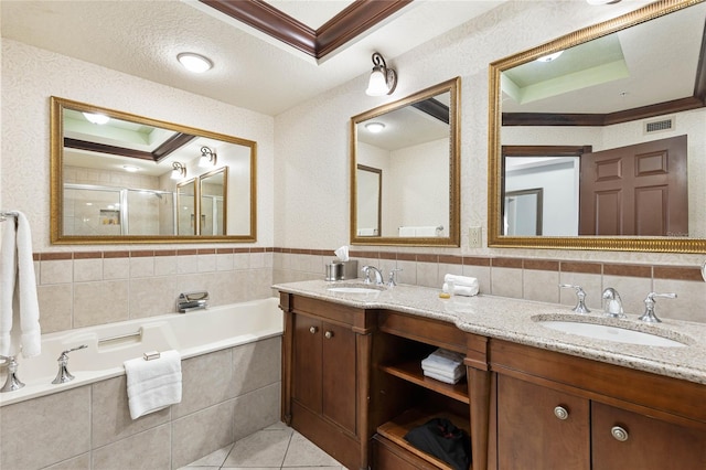 bathroom with vanity, crown molding, independent shower and bath, and a textured ceiling