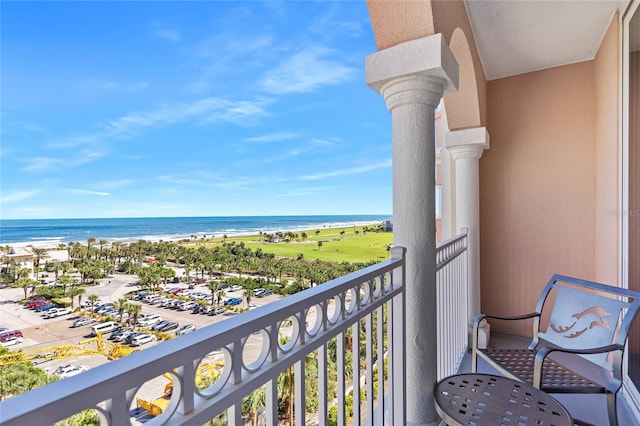 balcony featuring a water view