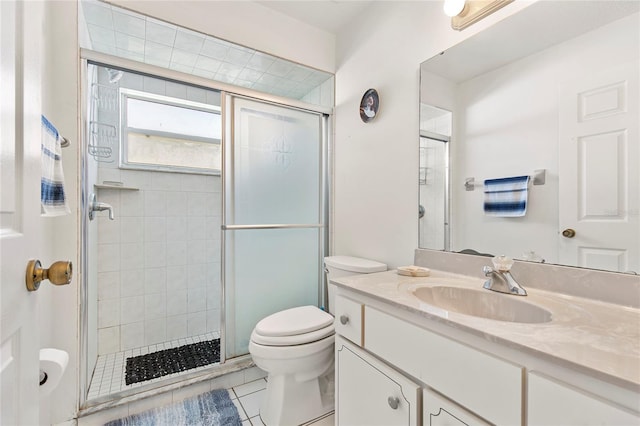 bathroom featuring tile patterned floors, vanity, toilet, and an enclosed shower