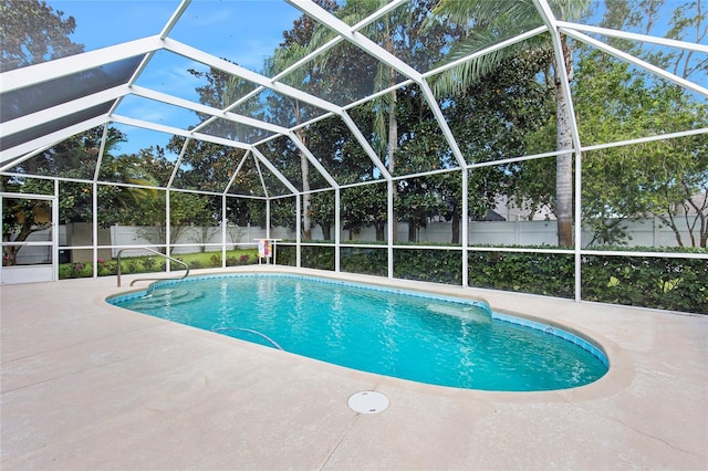 view of pool featuring a lanai and a patio