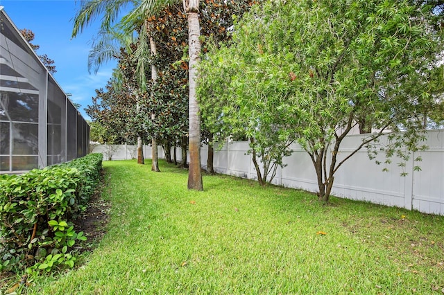 view of yard featuring a lanai