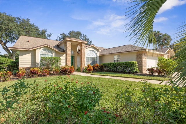 ranch-style house with a front yard and a garage